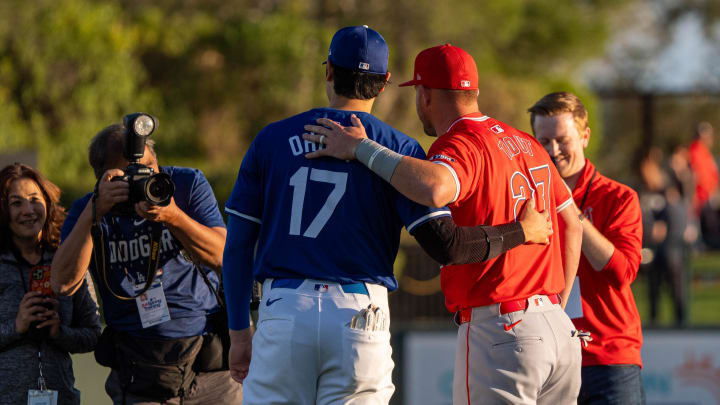 Mar 5, 2024; Phoenix, Arizona, USA;  Los Angeles Dodgers two-way player Shohei Ohtani (17) and Los Angeles Angels outfielder Mike Trout  (27) pose for a photo before the start of a spring training game at Camelback Ranch-Glendale. Mandatory Credit: Allan Henry-USA TODAY Sports