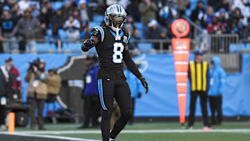 Dec 22, 2024; Charlotte, North Carolina, USA; Carolina Panthers cornerback Jaycee Horn (8) questions a call by the official  during the second half against the Arizona Cardinals at Bank of America Stadium. Mandatory Credit: Jim Dedmon-Imagn Images
