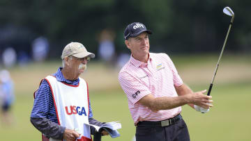 Jun 17, 2022; Brookline, Massachusetts, USA; Mike Cowan, left, talks with Jim Furyk on the 17th fairway during the second round of the U.S. Open golf tournament at The Country Club. 