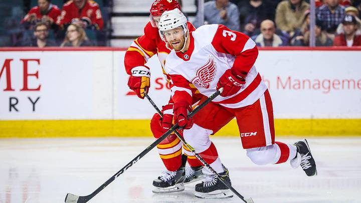 Jan 18, 2019; Calgary, Alberta, CAN; Detroit Red Wings defenseman Nick Jensen (3) skates with the puck against the Calgary Flames during the first period at Scotiabank Saddledome. Mandatory Credit: Sergei Belski-Imagn Images
