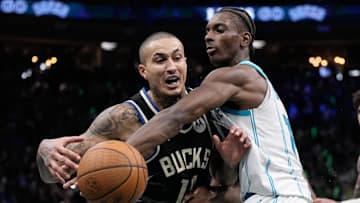 Nov 14, 2025; Milwaukee, Wisconsin, USA;  Charlotte Hornets forward Moussa Diabate (14) knocks the ball away from Milwaukee Bucks forward Kyle Kuzma (18) during the fourth quarter at Fiserv Forum. Mandatory Credit: Jeff Hanisch-Imagn Images