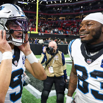 Jan 5, 2025; Atlanta, Georgia, USA; Carolina Panthers quarterback Bryce Young (9) celebrates with teammates after a victory over the Atlanta Falcons in overtime at Mercedes-Benz Stadium. Mandatory Credit: Brett Davis-Imagn Images