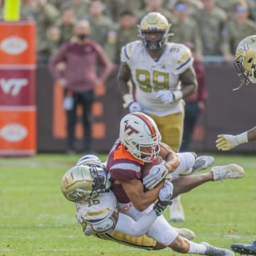 Nov 5, 2022; Blacksburg, Virginia, USA;   Virginia Tech Hokies wide receiver Jadan Blue (2) gets tackled by  tackled by Georgia Tech Yellow Jackets defensive back KJ Wallace (16) in the second half at Lane Stadium. Mandatory Credit: Lee Luther Jr.-USA TODAY Sports
