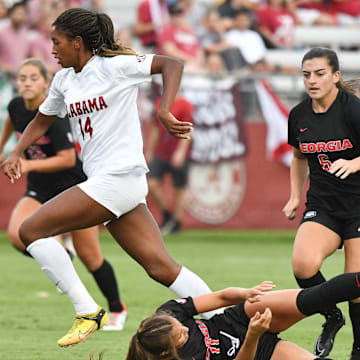 Alabama forward Gianna Paul (14) maneuvers for a shot past Georgia defender Kiera Staude. Alabama and Georgia played to a 1-1 tie at the Alabama Soccer Stadium Thursday, Sept. 14, 2023.