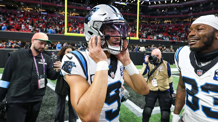 Jan 5, 2025; Atlanta, Georgia, USA; Carolina Panthers quarterback Bryce Young (9) celebrates with teammates after a victory over the Atlanta Falcons in overtime at Mercedes-Benz Stadium. Mandatory Credit: Brett Davis-Imagn Images Jan 5, 2025; Atlanta, Georgia, USA; Carolina Panthers quarterback Bryce Young (9) celebrates with teammates after a victory over the Atlanta Falcons in overtime at Mercedes-Benz Stadium. Mandatory Credit: Brett Davis-Imagn Images