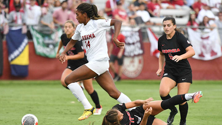 Alabama forward Gianna Paul (14) maneuvers for a shot past Georgia defender Kiera Staude. Alabama and Georgia played to a 1-1 tie at the Alabama Soccer Stadium Thursday, Sept. 14, 2023.