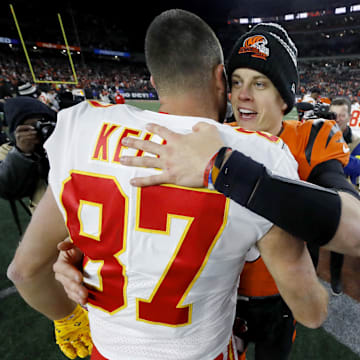 Dec 4, 2022; Cincinnati, Ohio, USA; Cincinnati Bengals quarterback Joe Burrow (9) and Kansas City Chiefs tight end Travis Kelce (87) meet following the game at Paycor Stadium. Mandatory Credit: Joseph Maiorana-Imagn Images