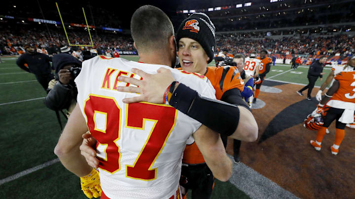 Dec 4, 2022; Cincinnati, Ohio, USA; Cincinnati Bengals quarterback Joe Burrow (9) and Kansas City Chiefs tight end Travis Kelce (87) meet following the game at Paycor Stadium. Mandatory Credit: Joseph Maiorana-Imagn Images