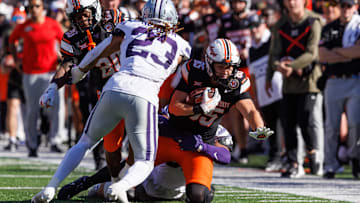 Nov 15, 2025; Stillwater, Oklahoma, USA; Oklahoma State Cowboys tight end Grayson Brousseau (85) is tackled during the second half against the Kansas State Wildcats at Boone Pickens Stadium. Mandatory Credit: William Purnell-Imagn Images
