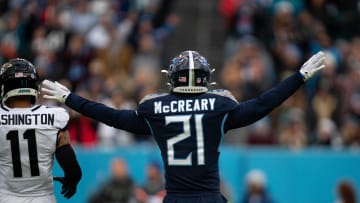 Tennessee Titans cornerback Roger McCreary (21) help out referee with a call against the Jacksonville Jaguars during their game at Nissan Stadium in Nashville, Tenn., Sunday, Jan. 7, 2024.