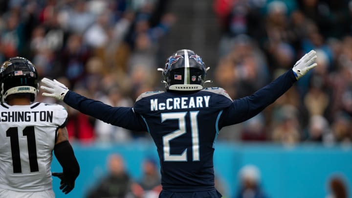 Tennessee Titans cornerback Roger McCreary (21) help out referee with a call against the Jacksonville Jaguars during their game at Nissan Stadium in Nashville, Tenn., Sunday, Jan. 7, 2024.