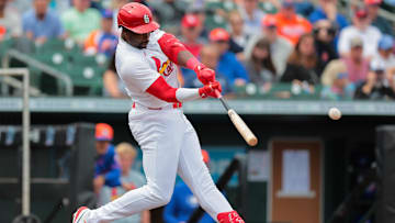 Feb 24, 2025; Jupiter, Florida, USA; Louis Cardinals outfielder Jordan Walker (18) hits a single against the New York Mets during the second inning at Roger Dean Chevrolet Stadium. Mandatory Credit: Sam Navarro-Imagn Images