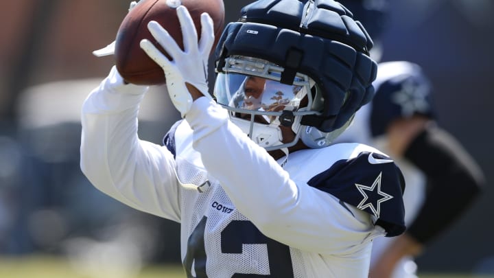 Jul 31, 2024; Oxnard, CA, USA; Dallas Cowboys running back Deuce Vaughn (42) makes a catch during training camp at the River Ridge Playing Fields in Oxnard, California.  