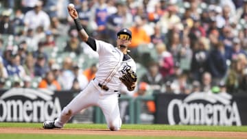 Apr 20, 2025; Detroit, Michigan, USA; Detroit Tigers third baseman Javier Baez (28) fields and throws out Kansas City Royals first baseman Salvador Perez (13) in the first inning at Comerica Park. Mandatory Credit: Aaron Doster-Imagn Images