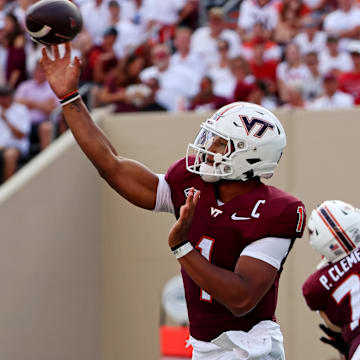 Sep 21, 2024; Virginia Tech quarterback Kyron Drones (1) throws a pass during the third quarter against Rutgers.