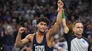 Penn State wrestler Carter Starocci celebrates after winning the 184-pound title at the 2025 NCAA Wrestling Championships.