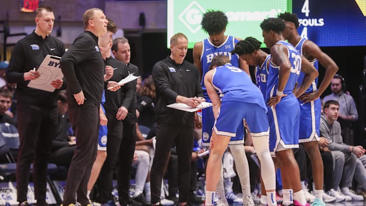 Feb 28, 2026; Morgantown, West Virginia, USA; BYU Cougars head coach Kevin Young talks to his team during a timeout during the first half against the West Virginia Mountaineers at Hope Coliseum. Mandatory Credit: Ben Queen-Imagn Images