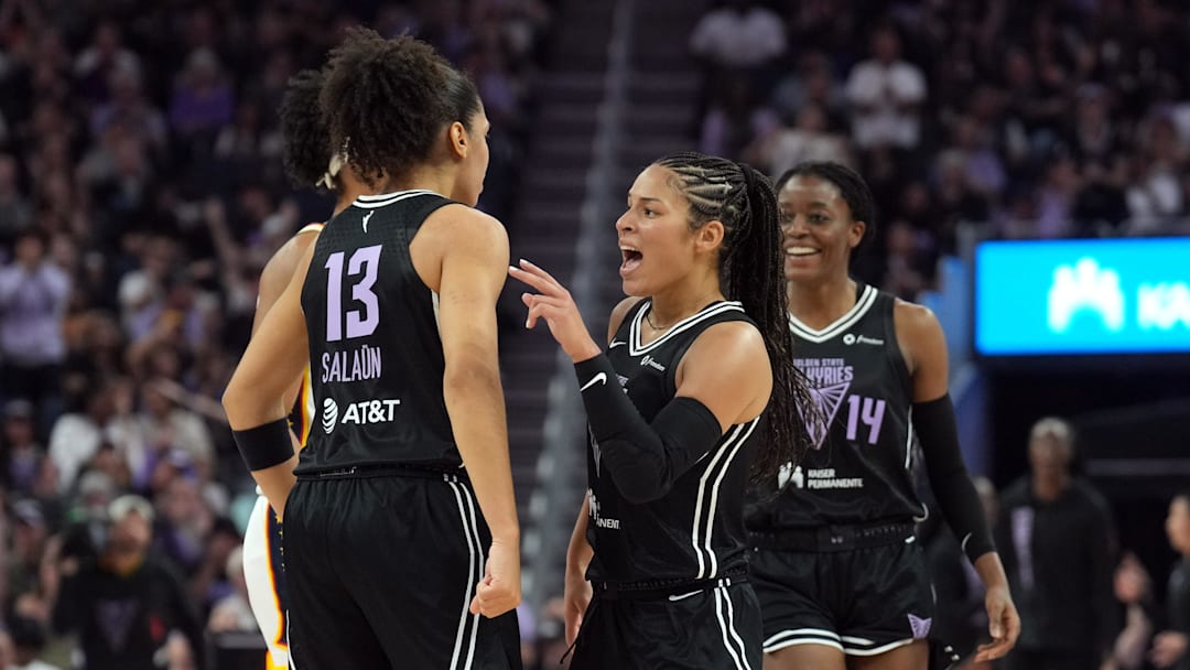 Aug 31, 2025; San Francisco, California, USA; Golden State Valkyries forward Janelle Salaun (13) is congratulated by guard Veronica Burton (center right) after making a three point basket against the Indiana Fever during the second quarter at Chase Center. Mandatory Credit: Darren Yamashita-Imagn Images