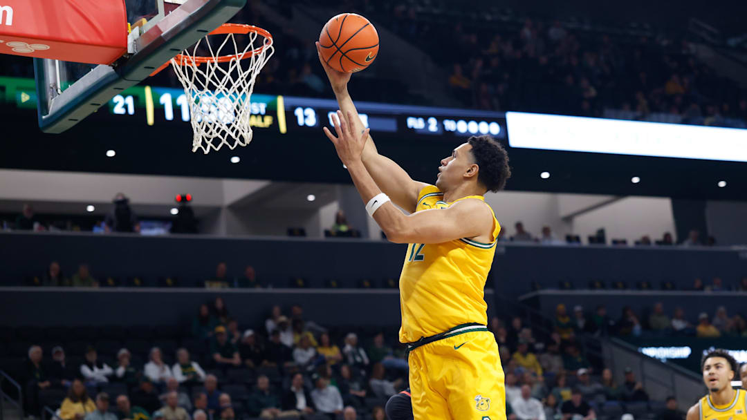 Mar 7, 2026; Waco, Texas, USA; Baylor Bears guard Michael Rataj (12) scores a layup against the Utah Utes during the first half at Paul and Alejandra Foster Pavilion. Mandatory Credit: Chris Jones-Imagn Images Mar 7, 2026; Waco, Texas, USA; Baylor Bears guard Michael Rataj (12) scores a layup against the Utah Utes during the first half at Paul and Alejandra Foster Pavilion. Mandatory Credit: Chris Jones-Imagn Images