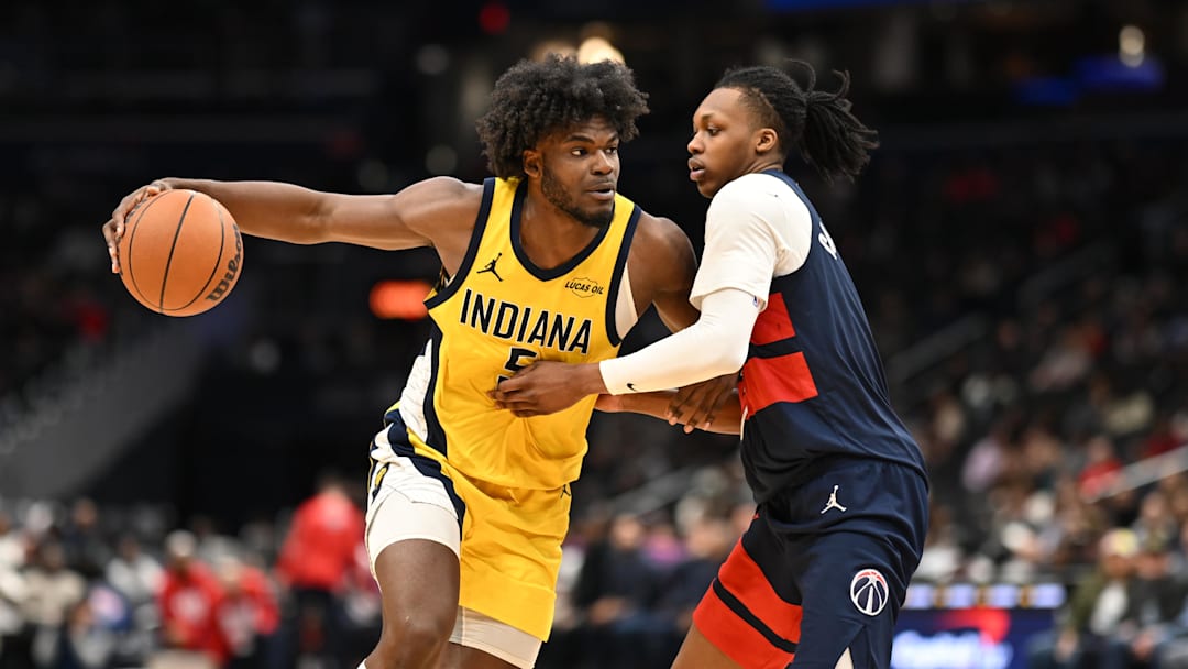 Feb 20, 2026; Washington, District of Columbia, USA; Indiana Pacers forward Jarace Walker (5) drives against Washington Wizards guard Bub Carrington (7) during the fourth quarter at Capital One Arena. Mandatory Credit: Rafael Suanes-Imagn Images
