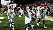 Nov 5, 2022; Nashville, Tennessee, USA; South Carolina Gamecocks offensive lineman Jakai Moore (55) and offensive lineman Vershon Lee (53) celebrate being bowl eligible after a win against the Vanderbilt Commodores at FirstBank Stadium. Mandatory Credit: Christopher Hanewinckel-Imagn Images