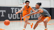 Tennessee forward Nate Ament and guard Amari Evans compete for the ball during a Vols practice.