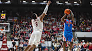 Jan 14, 2025; Tuscaloosa, Alabama, USA; Alabama Crimson Tide guard Chris Youngblood (8) attempts to block a shot by Mississippi Rebels guard Jaylen Murray (5) during the second half at Coleman Coliseum. Mandatory Credit: Will McLelland-Imagn Images