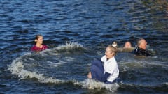 Nelly Korda jumps in a water hazard after winning the Chevron Championship