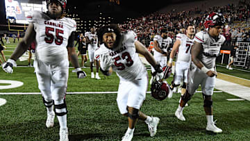Nov 5, 2022; Nashville, Tennessee, USA; South Carolina Gamecocks offensive lineman Jakai Moore (55) and offensive lineman Vershon Lee (53) celebrate being bowl eligible after a win against the Vanderbilt Commodores at FirstBank Stadium. 