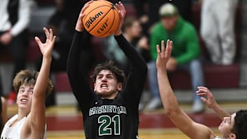 Greeneville's Trey Thompson (21) grabs the rebound during a high school basketball game between Greeneville and Bearden on Friday, December 16, 2022 in Knoxville, Tenn.
