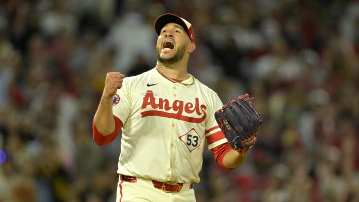 Jul 13, 2024; Anaheim, California, USA;  Carlos Estevez #53 of the Los Angeles Angels celebrates as he earns his 17th save of the season defeating the Seattle Mariners in the ninth inning at Angel Stadium. Mandatory Credit: Jayne Kamin-Oncea-USA TODAY Sports