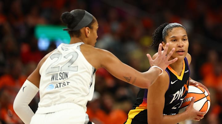 Oct 8, 2025; Phoenix, Arizona, USA; Phoenix Mercury forward Alyssa Thomas (25) dribbles the ball past Las Vegas Aces center A'ja Wilson (22) in the second half during game three of the 2025 WNBA Finals at PHX Arena. Mandatory Credit: Mark J. Rebilas-Imagn Images Oct 8, 2025; Phoenix, Arizona, USA; Phoenix Mercury forward Alyssa Thomas (25) dribbles the ball past Las Vegas Aces center A'ja Wilson (22) in the second half during game three of the 2025 WNBA Finals at PHX Arena. Mandatory Credit: Mark J. Rebilas-Imagn Images