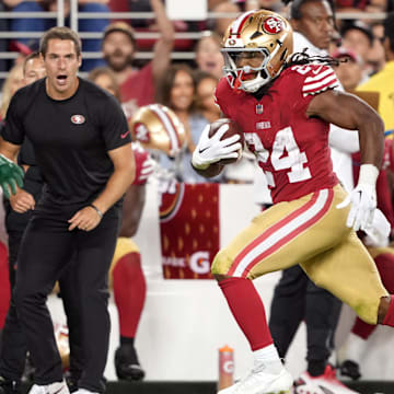 Sep 9, 2024; Santa Clara, California, USA; San Francisco 49ers running back Jordan Mason (24) carries the ball against New York Jets linebacker Quincy Williams (obscured right) during the fourth quarter at Levi's Stadium. Mandatory Credit: Darren Yamashita-Imagn Images