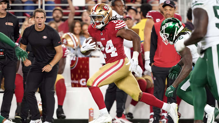 Sep 9, 2024; Santa Clara, California, USA; San Francisco 49ers running back Jordan Mason (24) carries the ball against New York Jets linebacker Quincy Williams (obscured right) during the fourth quarter at Levi's Stadium. Mandatory Credit: Darren Yamashita-Imagn Images