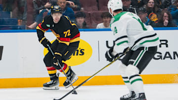 Mar 9, 2025; Vancouver, British Columbia, CAN; Vancouver Canucks forward Filip Chytil (72) drives toward Dallas Stars forward Jamie Benn (14) in the second period at Rogers Arena. Mandatory Credit: Bob Frid-Imagn Images