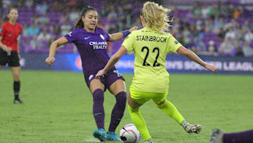 Oct 6, 2024; Orlando, Florida, USA; Orlando Pride midfielder Angelina (15) and Washington Spirit midfielder Heather Stainbrook (22) battle for the ball in the second half at Inter&Co Stadium. Mandatory Credit: Mike Watters-Imagn Images