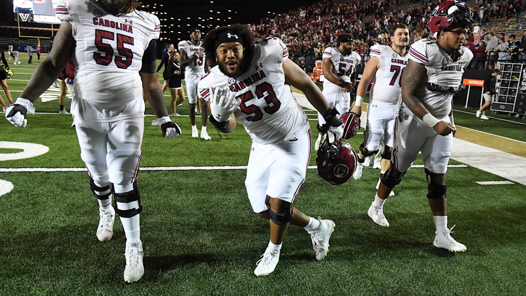 Nov 5, 2022; Nashville, Tennessee, USA; South Carolina Gamecocks offensive lineman Jakai Moore (55) and offensive lineman Vershon Lee (53) celebrate being bowl eligible after a win against the Vanderbilt Commodores at FirstBank Stadium. Mandatory Credit: Christopher Hanewinckel-Imagn Images Nov 5, 2022; Nashville, Tennessee, USA; South Carolina Gamecocks offensive lineman Jakai Moore (55) and offensive lineman Vershon Lee (53) celebrate being bowl eligible after a win against the Vanderbilt Commodores at FirstBank Stadium. Mandatory Credit: Christopher Hanewinckel-Imagn Images