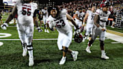 Nov 5, 2022; Nashville, Tennessee, USA; South Carolina Gamecocks offensive lineman Jakai Moore (55) and offensive lineman Vershon Lee (53) celebrate being bowl eligible after a win against the Vanderbilt Commodores at FirstBank Stadium. Mandatory Credit: Christopher Hanewinckel-Imagn Images