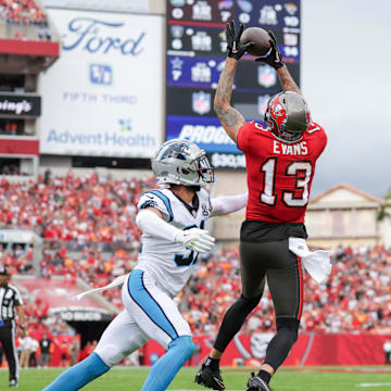 Dec 29, 2024; Tampa, Florida, USA; Tampa Bay Buccaneers wide receiver Mike Evans (13) catches a pass for a two point conversion against the Carolina Panthers in the second quarter at Raymond James Stadium. Mandatory Credit: Nathan Ray Seebeck-Imagn Images