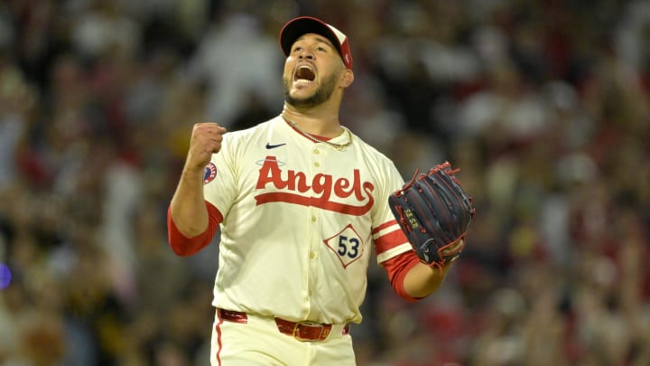 Jul 13, 2024; Anaheim, California, USA;  Carlos Estevez #53 of the Los Angeles Angels celebrates as he earns his 17th save of the season defeating the Seattle Mariners in the ninth inning at Angel Stadium. Mandatory Credit: Jayne Kamin-Oncea-USA TODAY Sports