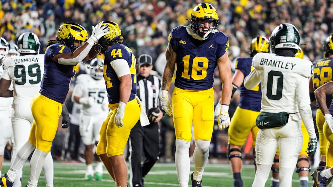 Michigan tight end Colston Loveland celebrates scoring a touchdown against Michigan State