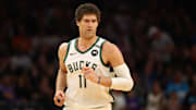 Mar 24, 2025; Phoenix, Arizona, USA; Milwaukee Bucks center Brook Lopez (11) against the Phoenix Suns at Footprint Center.