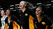 Iowa center Ava Heiden (5), Iowa forward Jada Gyamfi (23), Iowa guard Teagan Mallegni (55), and Iowa guard Kennise Johnson (13) react during a game against the Drake Bulldogs Nov. 13, 2025 at Carver-Hawkeye Arena in Iowa City, Iowa.