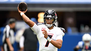 Sep 8, 2024; Indianapolis, Indiana, USA; Houston Texans quarterback C.J. Stroud (7) throws a pass to warm up before the game against the Indianapolis Colts at Lucas Oil Stadium. Mandatory Credit: Marc Lebryk-Imagn Images
