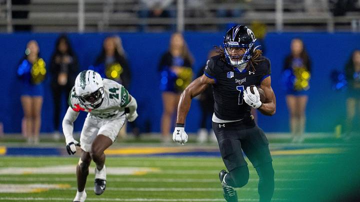 Nov 1, 2025; San Jose, California, USA; San Jose State Spartans wide receiver Leland Smith (1) runs for the first down after the catch against Hawaii Rainbow Wahine defensive back Devyn King (24) during the third quarter at CEFCU Stadium. Mandatory Credit: Neville E. Guard-Imagn Images