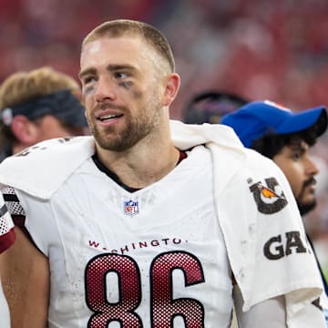 Sep 29, 2024; Glendale, Arizona, USA; Washington Commanders tight end Zach Ertz (86) with quarterback Jayden Daniels (5) against the Arizona Cardinals at State Farm Stadium. Mandatory Credit: Mark J. Rebilas-Imagn Images