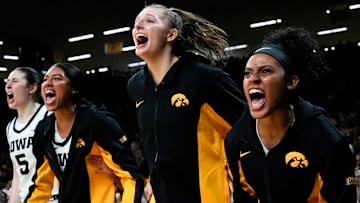 Iowa center Ava Heiden (5), Iowa forward Jada Gyamfi (23), Iowa guard Teagan Mallegni (55), and Iowa guard Kennise Johnson (13) react during a game against the Drake Bulldogs Nov. 13, 2025 at Carver-Hawkeye Arena in Iowa City, Iowa.