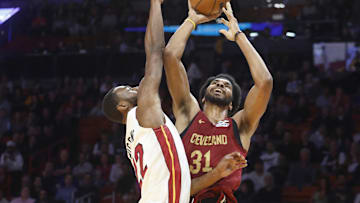 Nov 10, 2025; Miami, Florida, USA;  Miami Heat forward Andrew Wiggins (22) defends Cleveland Cavaliers center Jarrett Allen (31) during the first period at Kaseya Center. Mandatory Credit: Rhona Wise-Imagn Images