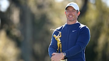 Rory McIlroy poses with the winner's trophy following his playoff victory at the 2025 edition of The Players Championship