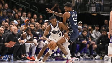 Nov 19, 2023; Dallas, Texas, USA; Sacramento Kings guard De'Aaron Fox (5) moves with the ball around Dallas Mavericks forward Derrick Jones Jr. (55) during the first quarter at the American Airlines Center. Mandatory Credit: Jerome Miron-USA TODAY Sports